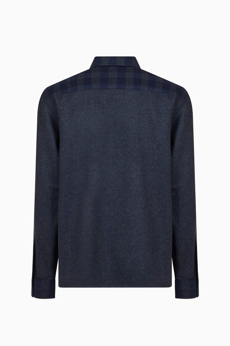IH NOM UH NIT FW26 dark navy flannel shirt with check panels and embroidered chest patch, back view