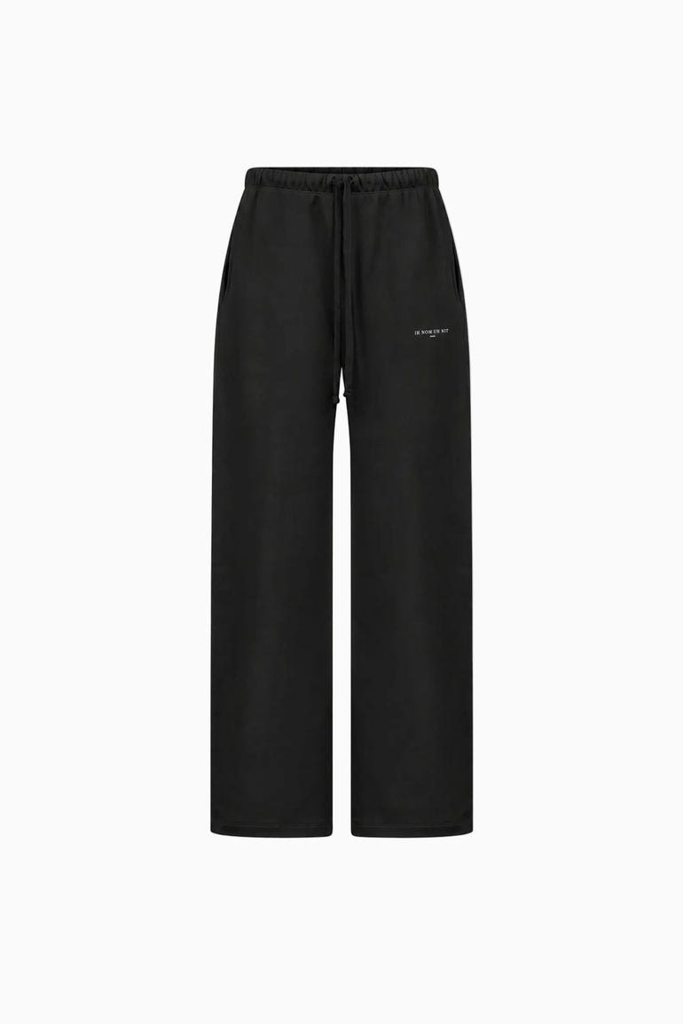 IH NOM UH NIT FW26 black wide-leg cotton sweatpants with drawstring waist and logo print, front view
